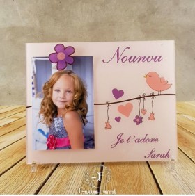 Une photo de votre enfant, sur un cadre que vous offrez à votre Nounou, pour la remercier.